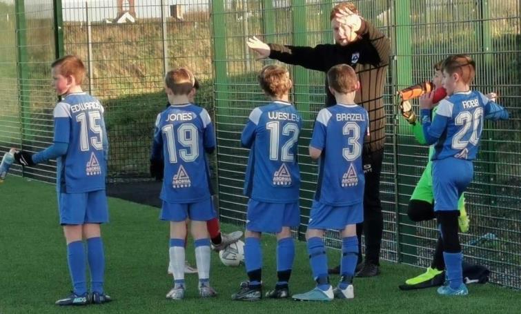 Harry with eager young players Harry with eager young players